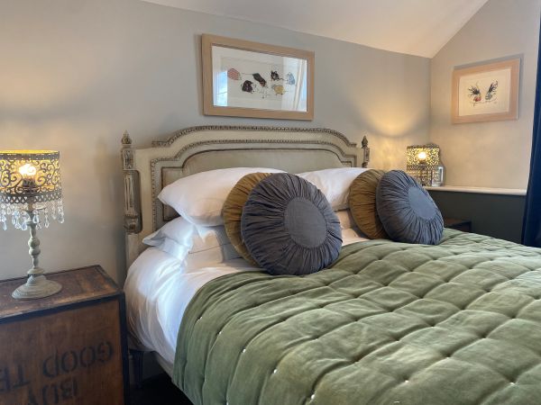 Grey Monkey suite bed with green throw at No.22 B&B Barnstaple